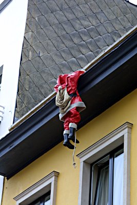 Santa Claus hanging from the roof